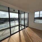 lights coming in inside the room through a sliding glass door