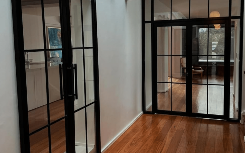 black framed doors in the hallway